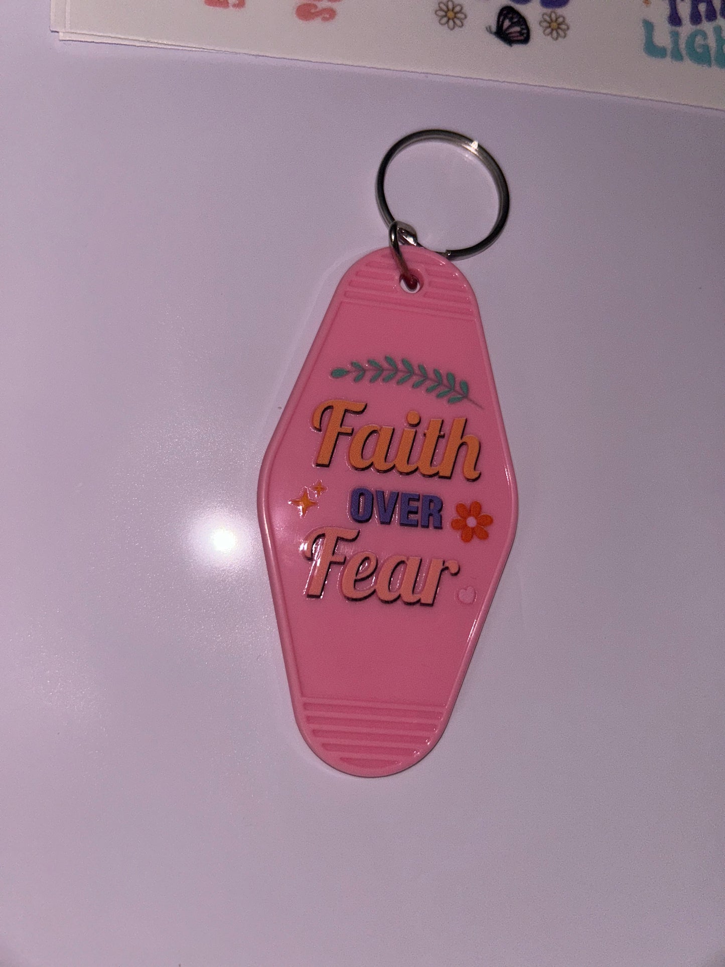 “Faith over fear” motel keychain